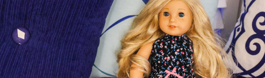 American Girl Doll in hotel bed