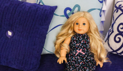 American Girl Doll in hotel bed